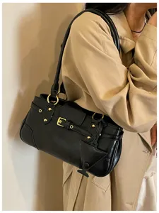 Chic vintage black shoulder bag for women, trendy baguette purse with metal details.