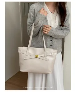 Minimalist shoulder tote bag with elegant bow belt design for daily women commute fashion.