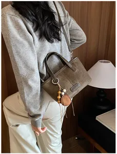Retro suede shoulder crossbody bucket bag for women, chic daily casual handbag with charm.