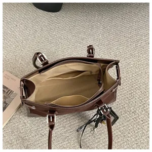 Detailed view of the dark brown leather women tote bag interior showing spacious pockets.