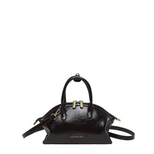 Sac à main en cuir PU brillant rétro avec poignées et bandoulière réglable pour femmes.