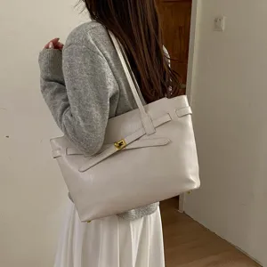 Elegant leather shoulder tote bag, large capacity vintage commuter handbag with stylish strap.
