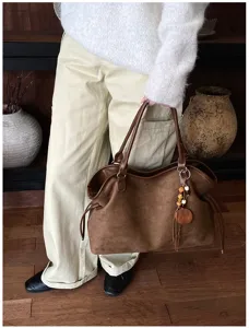Retro brown suede tote bag detail view, casual large capacity shoulder bag for use.