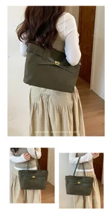 Vue détaillée du sac cabas rétro en suédine vert olive avec élégant fermoir pivotant métal.