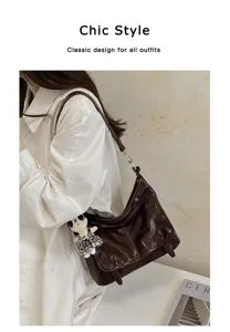 Chic brown leather messenger bag for women, stylish vintage shoulder bag with cute charm.