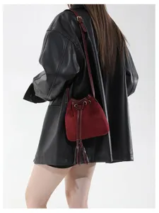 Retro suede bucket bag for women, stylish tassel shoulder and crossbody handbag for autumn.
