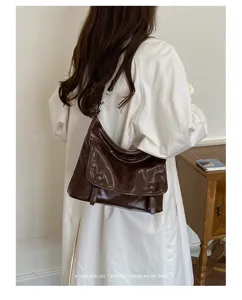 Retro glossy brown women shoulder messenger bag detailed view showing texture and elegant style.