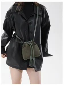 Detail view of stylish retro frosted bucket bag with tassel drawstring for daily wear.