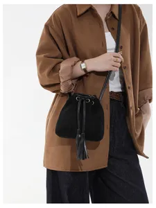 Trendy retro frosted shoulder bag for women, stylish suede bucket bag with fringe and strap.