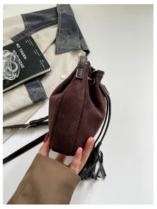 Retro suede bucket bag for women, autumn winter fashion tassel drawstring shoulder bag.