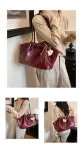 Detailed view of a retro wine-red PU leather tote shoulder bag, perfect for daily office commuting.