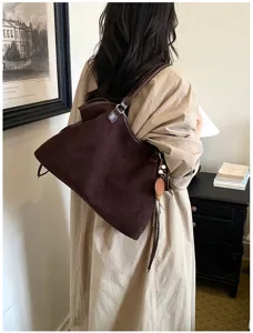 Detailed view of retro brown suede tote bag, casual large capacity shoulder bag for women commute.