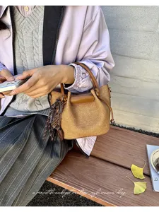 Chic textured bucket handbag for women, autumn fashion versatile vintage style shoulder bag.