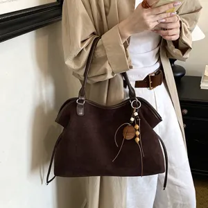 Retro brown suede tote bag for women, casual large capacity commuting shoulder bag with chic charms.