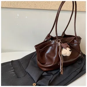 Vintage dark brown PU leather tote bag with cute puppy keychain, stylish shoulder bag for women.