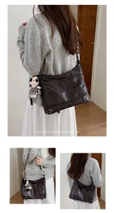 Stylish retro messenger bag for women, versatile shoulder crossbody bag with cute doll.