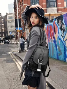 Stylish black soft leather backpack for women, casual large capacity travel rucksack.