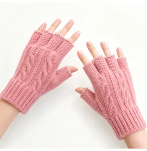 Close-up of pink cable knit fingerless gloves, warm winter handwear for typing and daily wear.