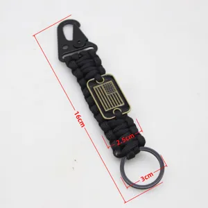 Outdoor paracord survival keychain with US flag design, metal snap hook and key ring, portable gear.