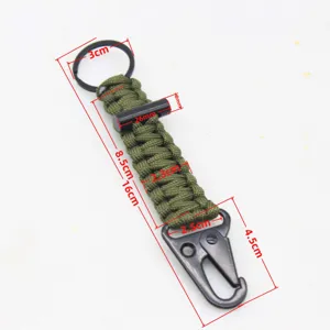 Paracord keychain with carabiner and magnesium fire starter survival tool for outdoor camping.