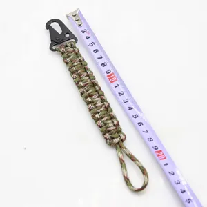 Detailed view of the tactical 7-core paracord keychain with a sturdy metal eagle beak clip.