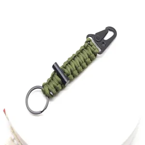 Paracord keychain with carabiner and flint survival tool for outdoor camping and hiking.