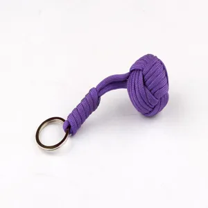 Purple paracord keychain detail showing tight weaving texture and sturdy metal ring fastener.