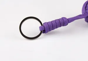 Close-up detail view of the purple paracord keychain featuring a sturdy metal ring.