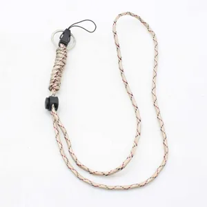 Detail shot of beige braided paracord strap showing the adjustable buckle and metal ring connectors.