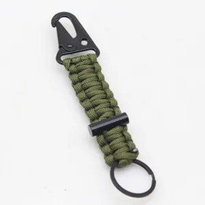 Paracord keychain with black carabiner, survival fire starter and metal ring for outdoor use.