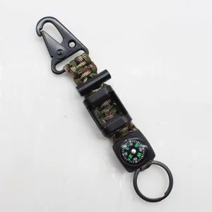 Multitool outdoor survival paracord keychain with compass and fire starter for camping.