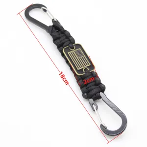 Detailed view of the 7-core paracord survival keychain with metal carabiners and US flag tag.