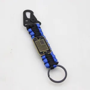 Tactical paracord keychain with eagle clip and American flag metal tag for outdoor survival gear.