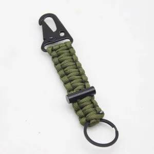 Tactical paracord keychain with carabiner and survival magnesium fire starter for outdoor use.
