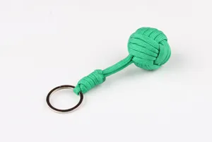 Green paracord monkey fist keychain, durable 7-strand survival rope with metal ring for outdoor.