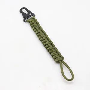 Military green 7-strand paracord keychain with sturdy black metal carabiner for outdoor use.