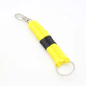 Handmade woven paracord keychain with metal clasp and ring, durable outdoor accessory detail shot.