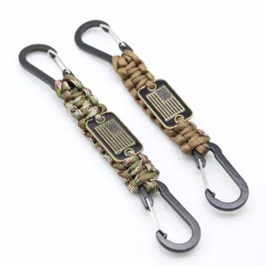 Paracord keychain with carabiner and US flag badge, durable survival lanyard and EDC gear.