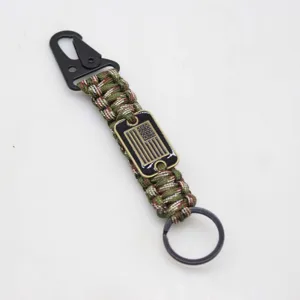 Detail view of tactical paracord keychain with metal carabiner and American flag plate.