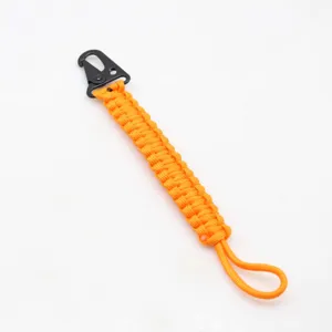 Orange paracord keychain with black carabiner hook, detailed view of braided tactical cord.