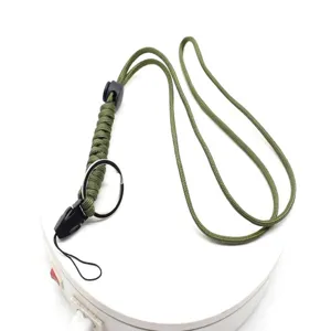 Detailed view of the military green woven paracord lanyard featuring durable metal ring for gear.