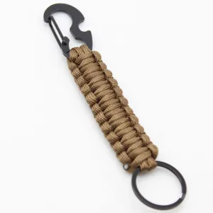 Detailed view of the tactical paracord keychain with black metal carabiner and bottle opener.