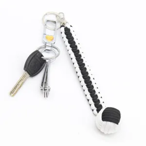 Llavero de mono paracord negro blanco supervivencia cuerda anillo exterior