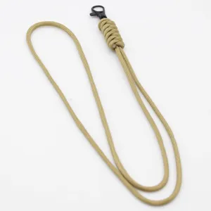 Close up detail of khaki paracord lanyard with black metal clasp for keys and ID cards.