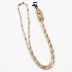 Detailed view of the handmade paracord lanyard with durable metal hook and neat braided texture.