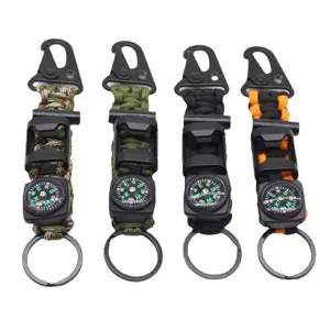 Multifunctional outdoor survival paracord keychain with compass and carabiner hook.
