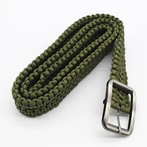 Green paracord belt handmade tactical survival strap outdoor adventure gear detail.