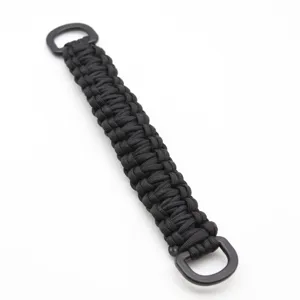 Close-up of black paracord woven bag handle strap detail with sturdy D-rings for backpacks.