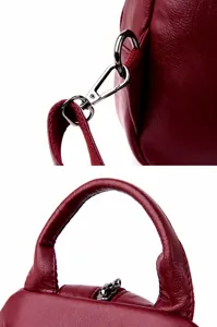 Women leather backpack detail strap and handle closeup stylish casual design red bag.