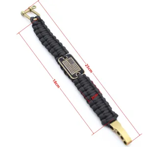 Black paracord survival bracelet with American flag metal tag and adjustable buckle for outdoor sports.